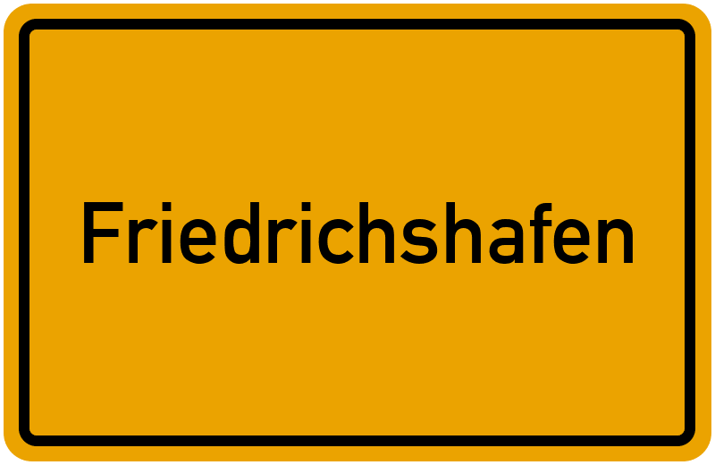 Gelbes Ortsschild mit schwarzer Aufschrift Friedrichshafen