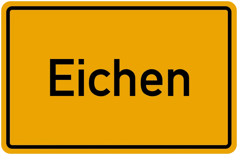 Gelbes Ortsschild mit schwarzem Rand und der schwarzen Aufschrift Eichen.