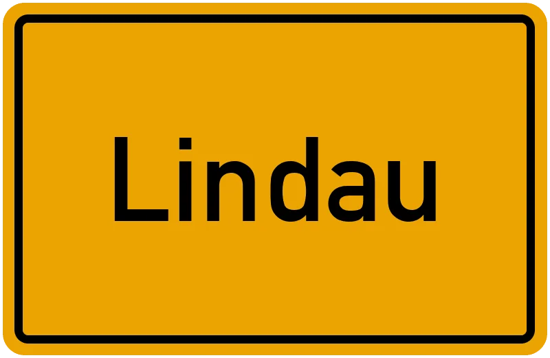 Gelbes Ortsschild mit schwarzer Aufschrift Lindau und schwarzem Rand.